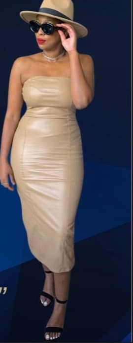 Wara the Stylist client styled in a tan leather dress and hat
